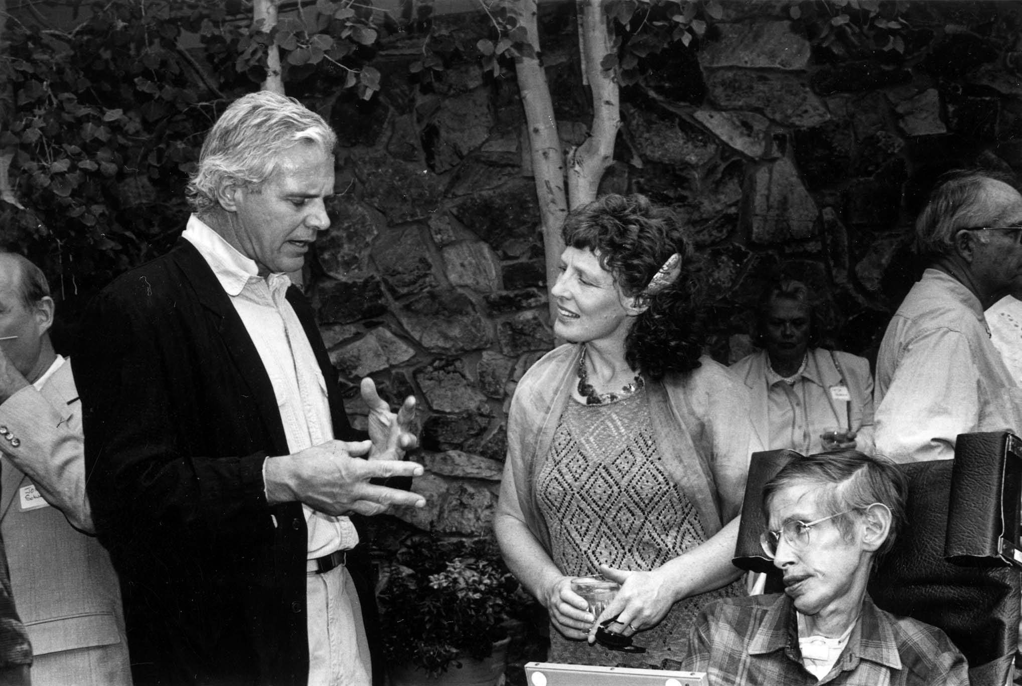 Photograph of Basalt architect Harry Teague, Elaine Mason (wife of Stephen Hawking), and Dr. Stephen Hawking at an Aspen Center for Physics event honoring Dr. Hawking, July 1995. Photo courtesy of Aspen Historical Society.