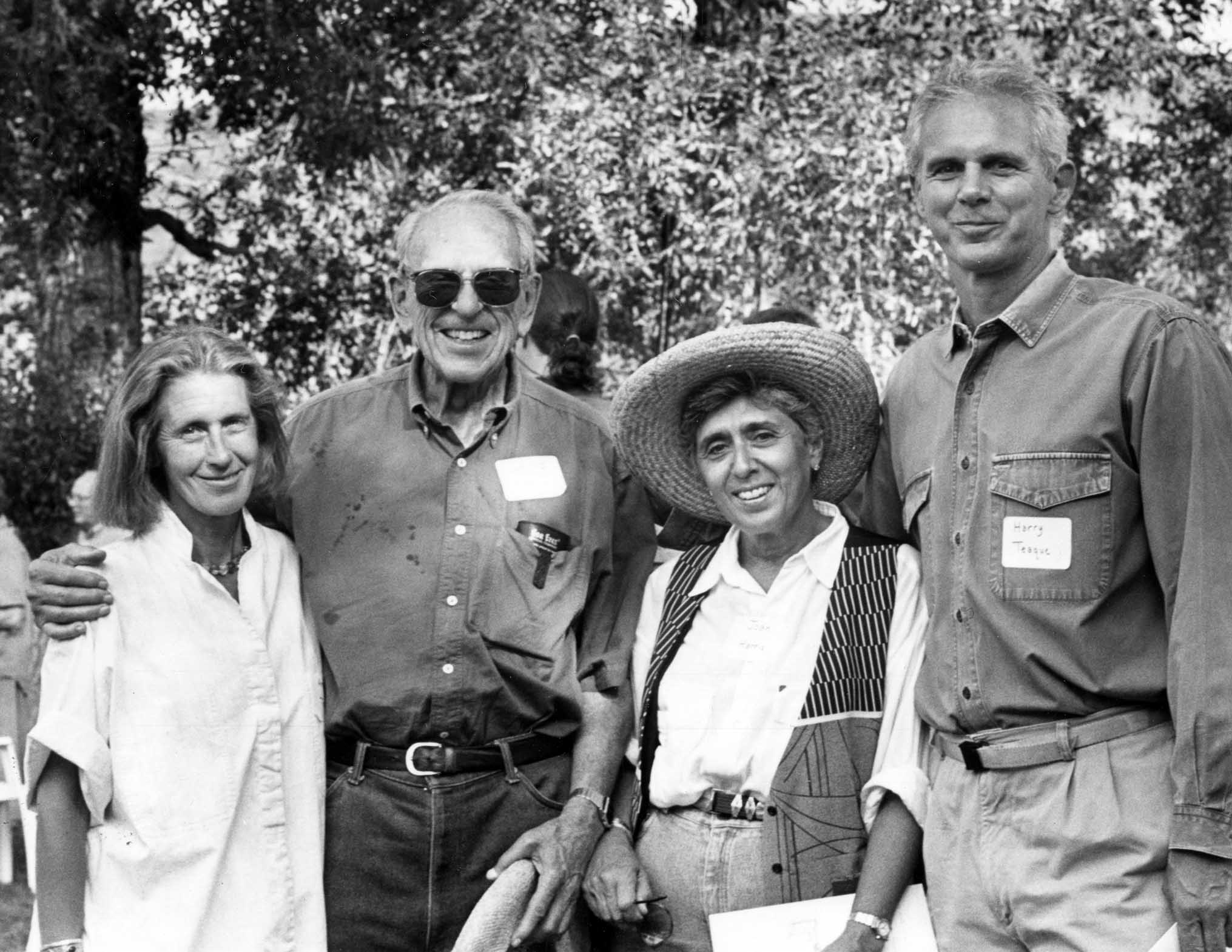 One b/w photograph of Annie Teague, Irving Harris, Joan Harris and Harry Teague at the groundbreaking ceremony for a new building at the Aspen Center for Physics, September 1995. This image appeared in Mary Eshbaugh Hayes' column "Around Aspen" on September 23-24, 1995 with the caption, "At the groundbreaking ceremony for the new Physics Center building are, left to right: Annie Teague; Irving and Joan Harris, who provided funding for the new concert hall for the Aspen Music Festival; and Harry Teague, who is architect for both Harris Hall and the new Physics building." Photo courtesy of Aspen Historical Society.