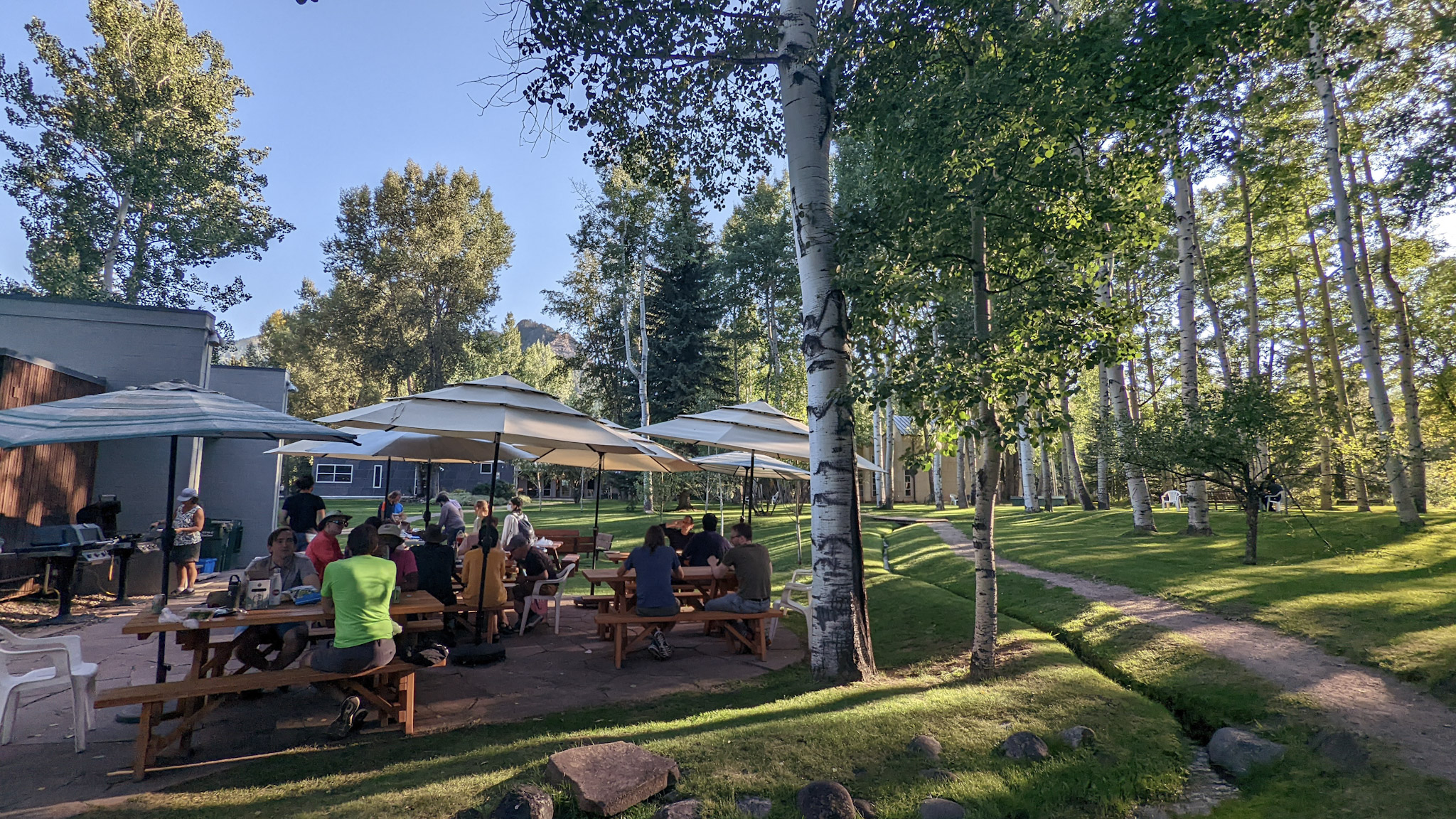 Physicist Picnic & Family Barbeque at the Aspen Center for Physics; physicists gathered around picnic tables.