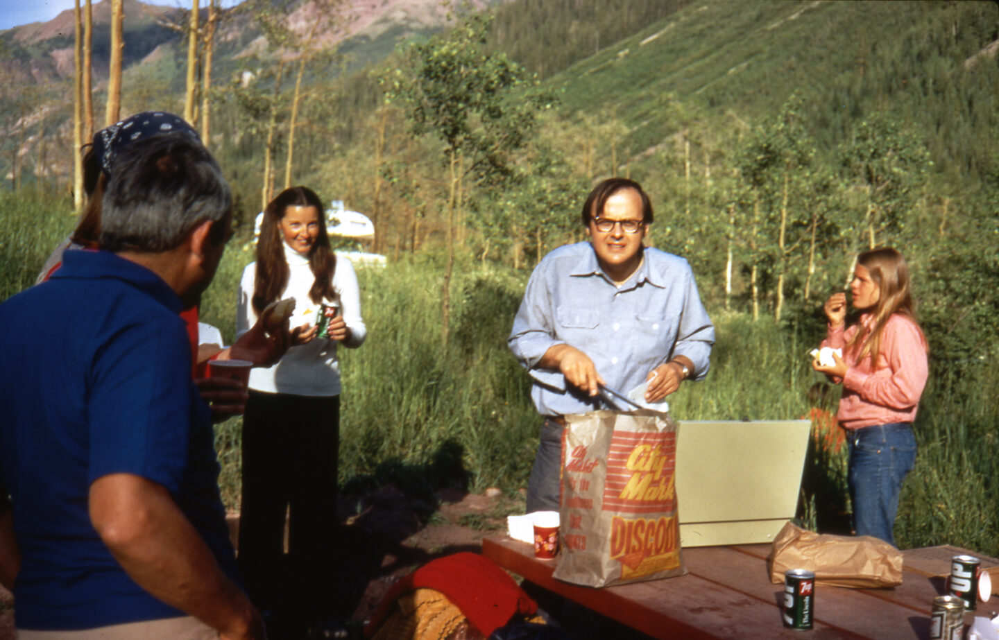 Picnic at Maroon Lake, Aspen, Colorado, 1972, L-R: Edwin L. Goldwasser (blue shirt), Deputy Director, Fermilab, Isabel Walker (white top, black hair); James Sanford, Fermilab; unidentified woman.